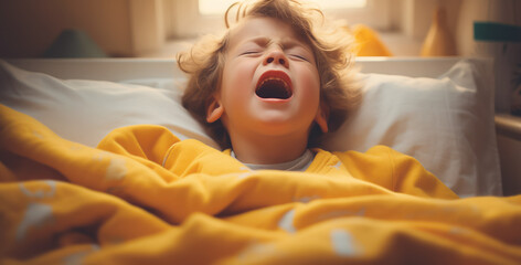 Little sick child crying in bed in bedroom.
