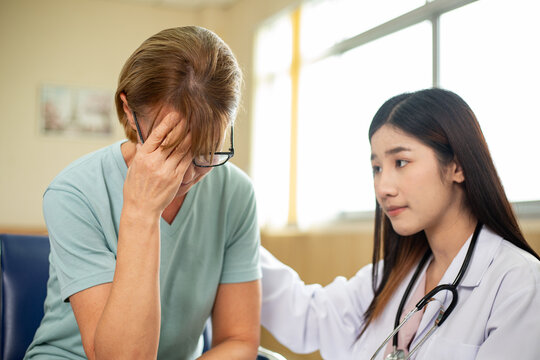 Asian doctor woman consoled patient woman
