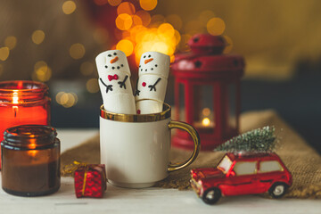 Marshlellow snowmen in a mug. Hot chocolate with marshmallows. Christmas mood. Funny and cute...