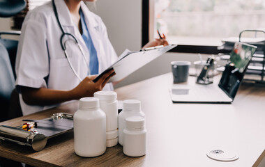 Medical technology concept. Doctor working with mobile phone and stethoscope in modern office