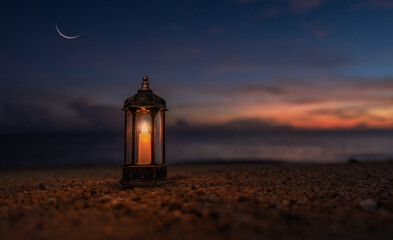Lantern candle on sand beach twilight sunset sky and crescent moon, Religion of Islamic well free...