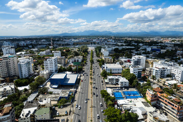 Fototapeta premium Beautiful aerial view of the city of Santo Domingo - Dominican Republic with is Parks, buildings, suburbs ,turquoise Caribbean ocean, parks and malecon