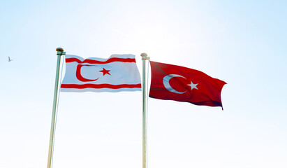 Turkish Republic of Northern Cyprus and Turkey flags waving together on blue sky. 