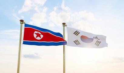 North Korea and South Korea flags waving together on blue sky. 4K ULTRA HD. 