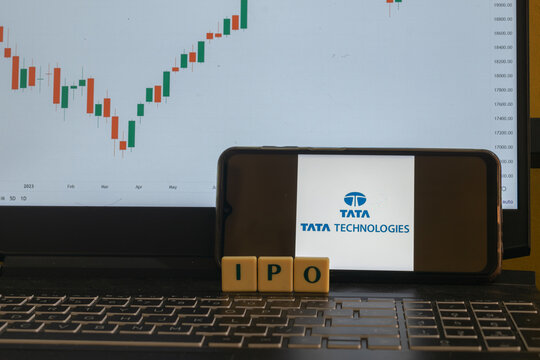 Mumbai, India - 04 November 2023, 
Letter blocks arranged as IPO. Logo of tata technologies and stock market charts in background. Share, price, gmp, face value, split, bonus, dividend, profit, loss.