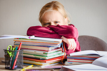 Learning Difficulties. Stressed Angry SchoolChild lying on Books Pile on Gray Background. School...