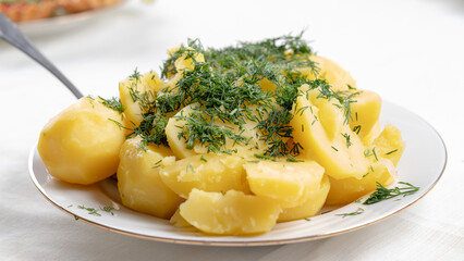 boiled potatoes with dill on a plate