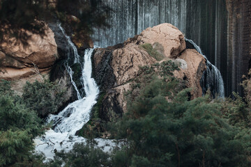 Spectacular waterfall in the Elche reservoir. In Elche, Alicante, Valencian community, Spain