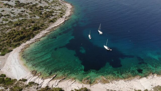 Zirje island in Croatia. Paradise cove with sailing yachts. Drone view of Croatia.