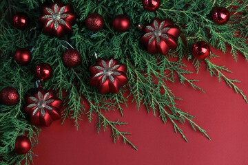 Red winter background with christmas decorations and copy space