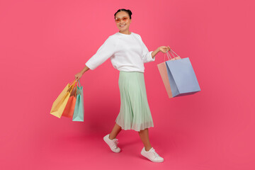 Shopping Concept. Happy Beautiful Asian Woman Walking With Bright Shopper Bags