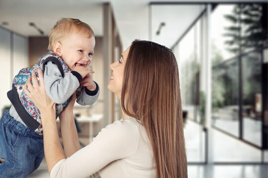 Happy young mother and child at home, AI generated image