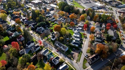 Naklejka na ściany i meble Countryside landscape showing typical small town USA living with streets, business, and neighborhoods in Wellsboro, Pennsylvania during Autumn Fall season colors 