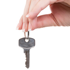 house key in hand as symbol for real estate trading isolated against transparent background