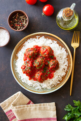 Rice with meatballs in tomato sauce. Italian food.