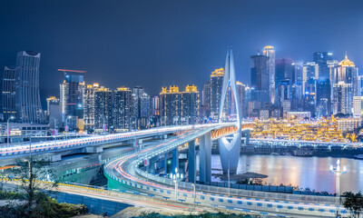 Chongqing city center buildings skyline and bridge at night
