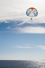Parasailing Bliss: Soaring High in the Sky on a Sunny Day
