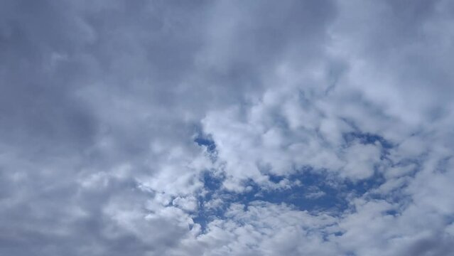 Altocumulus cloud of dark tones circulating through the sky