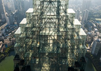 View of the pyramid-shaped dome of a modern, sky-scraping building.