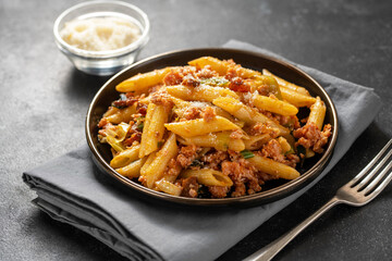 Pasta bolognese with minced meat and cheese. 