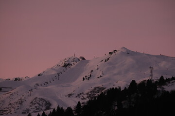 Embrace the enchanting beauty of gentle slopes beneath a pastel sky, where the season paints the...