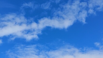 the sky has very blue and white clouds in it,