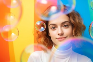 happy woman on colorful background with rainbow soap balloon with gradient