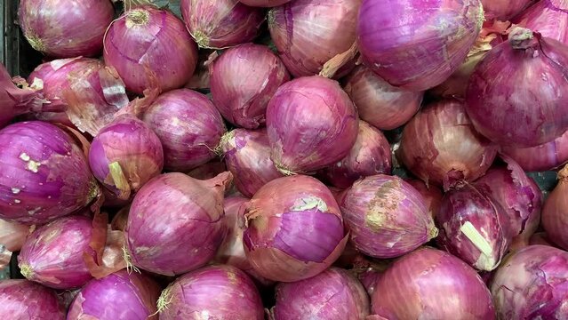 Video of onions for sale at a local market. Food concept.