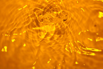 The surface of the water splashes orange.