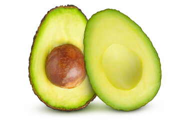 Cut avocado with and without pit on an isolated white background.