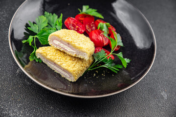 cordon bleu cutlet chicken meat, cheese, bacon snack meal food on the table copy space food background rustic top view