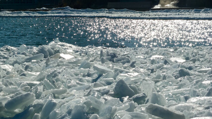 Frozen Black Sea, blocks of melting ice on the seashore