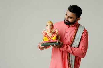 Young Indian man with Lord Ganesha , Celebrating Ganesha festival
