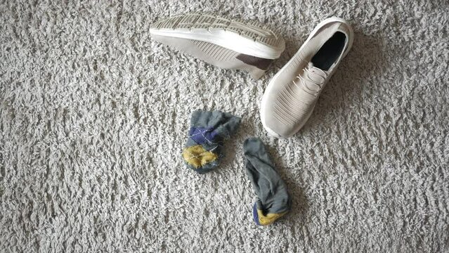 dirty sock and shoe on floor 