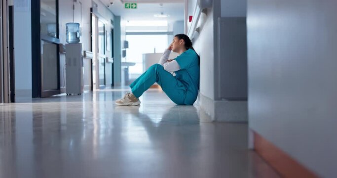 Nurse, stress and sad on floor for hospital mistake, healthcare fail or bad news of clinic death. Mental health of medical worker, tired woman or doctor with depression, anxiety or fatigue for crisis