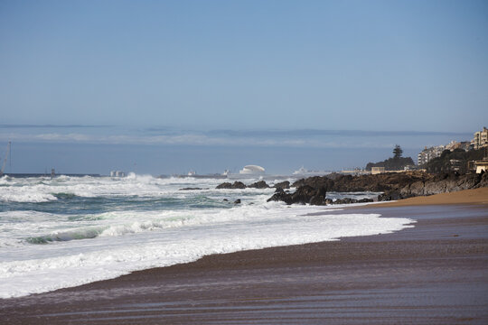 Praia de Carnero, sandy beach in Porto with big waves of the ocean, springtime