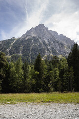Beautiful landscape of the natural park of Aig&uuml;estortes y Estany de Sant Maurici, Pyrenees valley with river and lake