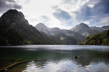 Fototapeta na wymiar Lake Sant Maurici in national park of Aigüestortes y Estany de Sant Maurici, beautiful landscape in the Pyrenees mountains, Spain