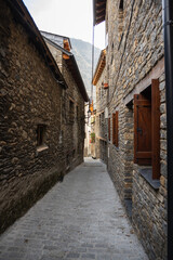 Narrow street in the medieval village Espot, Pyrenees © olly_plu