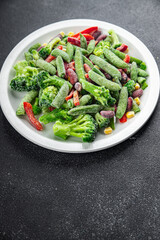 vegetable frozen mix broccoli, corn, carrot, green pea, green bean, bell pepper, bean fresh vegetables delicious healthy eating cooking appetizer meal food snack on the table copy space food