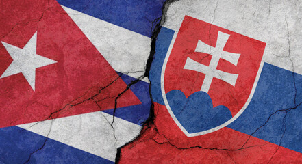 Flags of Cuba and Slovakia, texture of concrete wall with cracks, grunge background, military conflict concept
