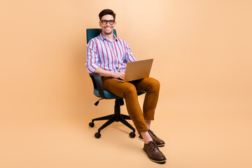 Photo of attractive cheerful man expert boss it specialist use modern gadget macbook netbook...
