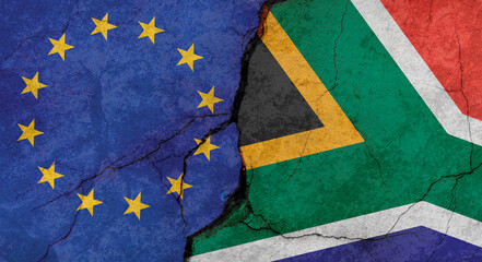 European Union and South Africa flags, concrete wall texture with cracks, grunge background, military conflict concept