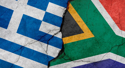 Greece and South Africa flags, concrete wall texture with cracks, grunge background, military conflict concept