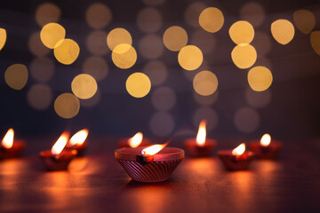Beautiful clay lamp isolated on bokeh light, Diwali concept poster image