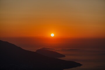 Beautiful mountain landscape with sunset sky with sea
