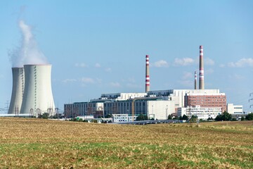 Fototapeta na wymiar Cooling towers at nuclear power plant, energy self-sufficiency, greenhouse emission reduction
