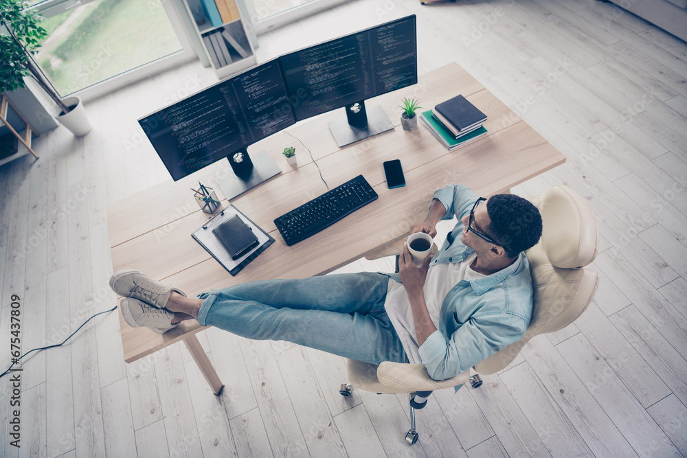Aufkleber upper view photo of relaxing professional programmer guy lying armchair drinks coffee decide create 