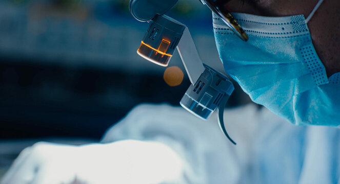 surgery with microscope glasses, neurosurgery.