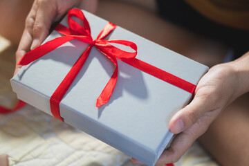 Woman giving a christmas or birthday gift